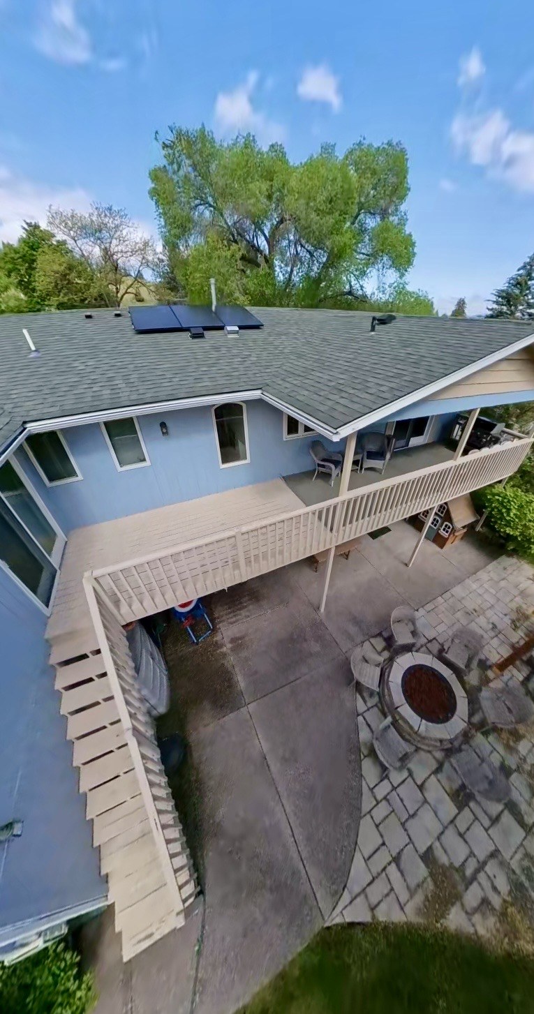 Aerial view of the original wood deck with white picket railing before replacement